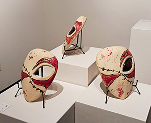 Image of the clay sculptures, Blood Soaked Masks by Harold Sanchez.